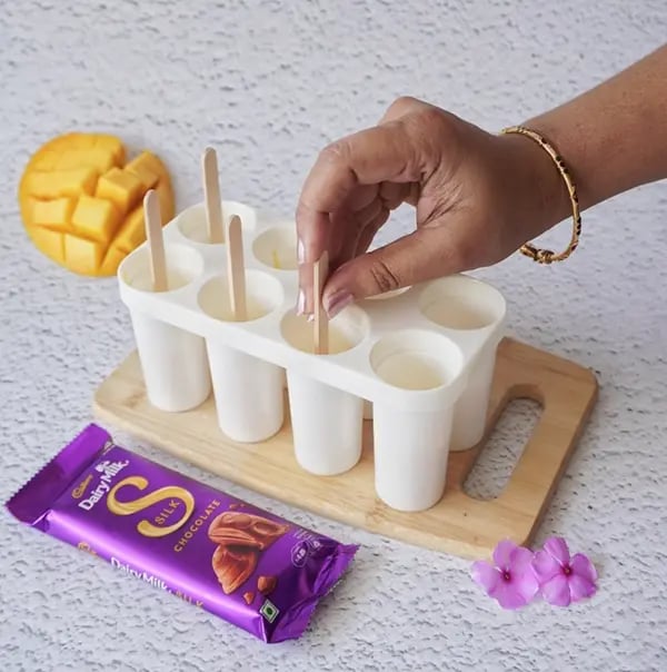 Cadbury Dairy Milk Silk and Mango Layered Kulfi with Cashew Nuts - Insert an ice cream stick
