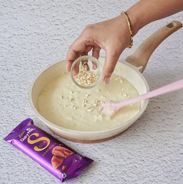 Cadbury Dairy Milk Silk and Mango Layered Kulfi with Cashew Nuts - Stir in the chopped cashew nuts