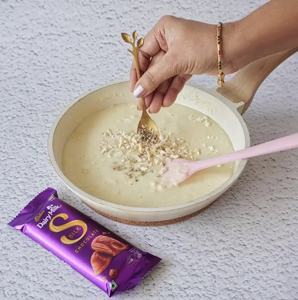 Cadbury Dairy Milk Silk and Mango Layered Kulfi with Cashew Nuts - Add cardamom powder
