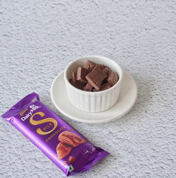 Cadbury Dairy Milk Silk and Mango Layered Kulfi with Cashew Nuts - For the chocolate layer Break the Cadbury Dairy Milk chocolate