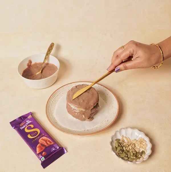 Cadbury Dairy Milk Silk Chocolate Cake with Bread slices-Place another bread slice