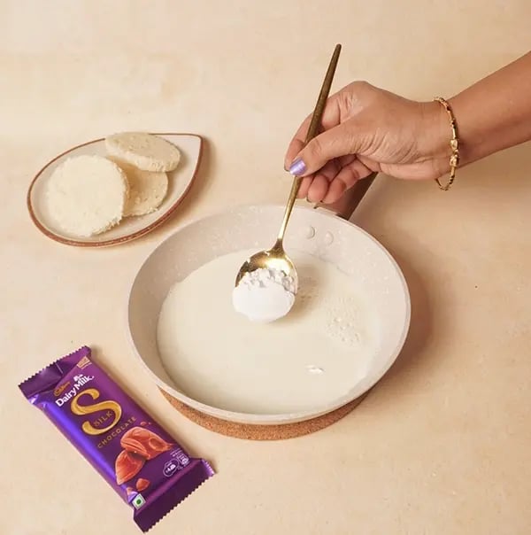 Cadbury Dairy Milk Silk Chocolate Cake with Bread slices-In a saucepan pour