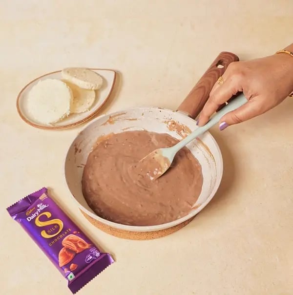 Cadbury Dairy Milk Silk Chocolate Cake with Bread slices-Continue stirring until the chocolate mixtur