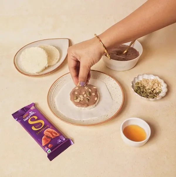 Cadbury Dairy Milk Silk Chocolate Cake with Bread slices-Sprinkle some chopped nuts