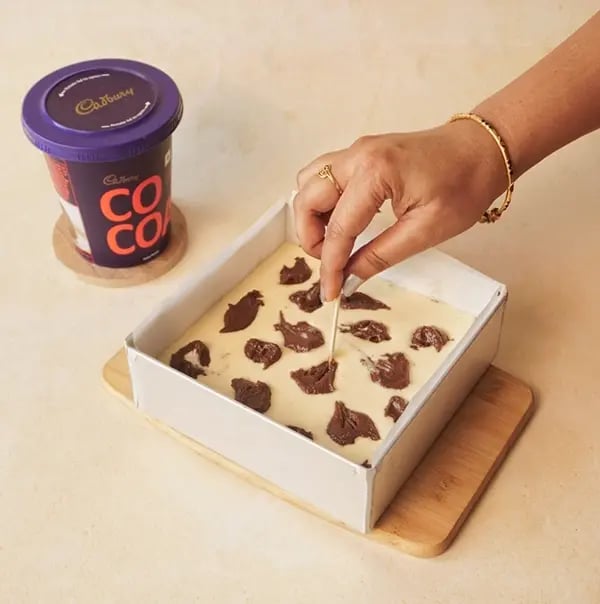 Cheesecake Brownie-Spoon the reserved brownie batter