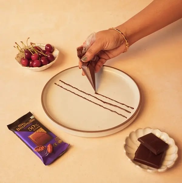 Cherry Notes On A Plate With Cadbury Bournville-On a clean white plate