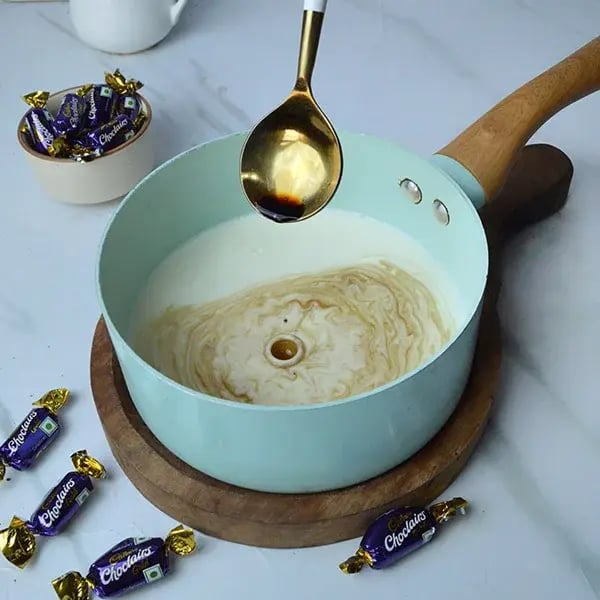 Choclairs drizzle in creamy custard pudding - Add the vanilla essence