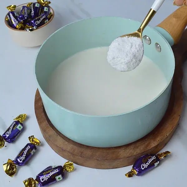 Choclairs drizzle in creamy custard pudding - Add powdered sugar