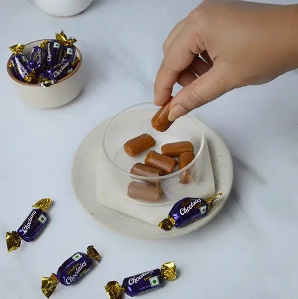 Choclairs drizzle in creamy custard pudding - Add choclairs chocolates