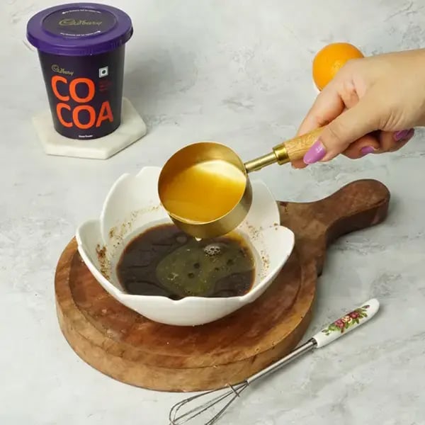 Choco Orange Cake With Hazelnut Garnish - Add the orange juice