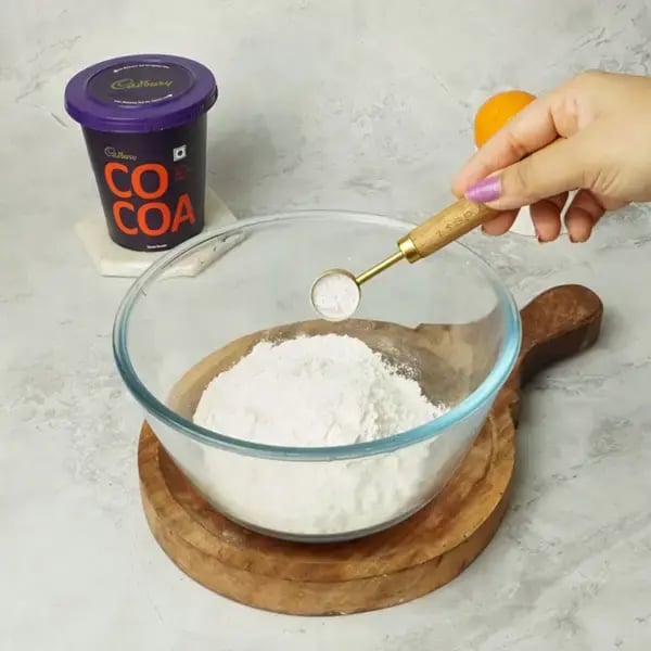 Choco Orange Cake With Hazelnut Garnish - Sift the all-purpose flour, baking powder, and baking soda directly