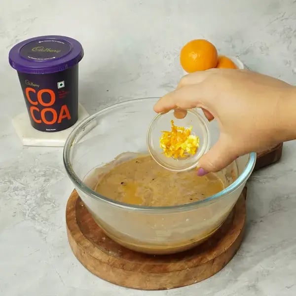 Choco Orange Cake With Hazelnut Garnish - Add the freshly grated zest of one orange