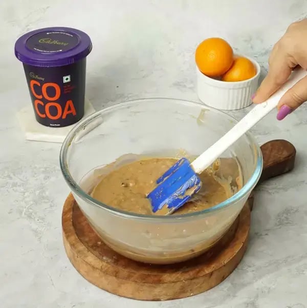 Choco Orange Cake With Hazelnut Garnish - Gentle mix to ensure the zest is evenly distributed