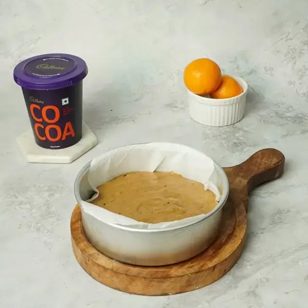 Choco Orange Cake With Hazelnut Garnish - Pour the batter