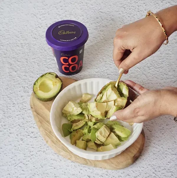 Chocolate Avocado Mousse with Coconut Milk - Slice the ripe avocados in half