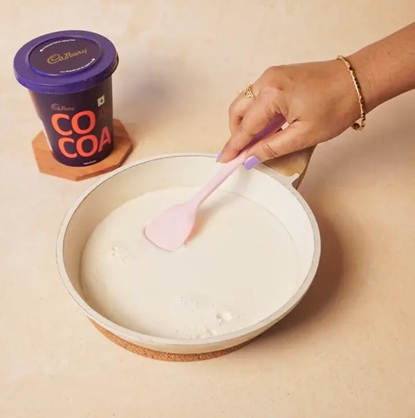 Chocolate Basundi with Mango-In a pan bring the milk to a boil