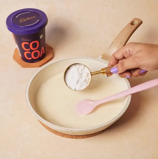Chocolate Basundi with Mango-Stir in powdered sugar