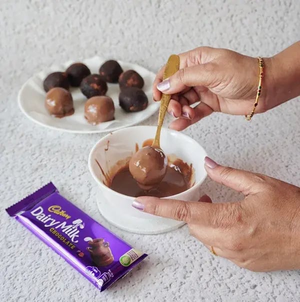 Chocolate Brownie Truffles - Dip each brownie ball