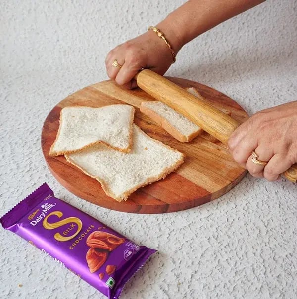 Chocolate Coated Bread Roll - Flatten each slice of bread