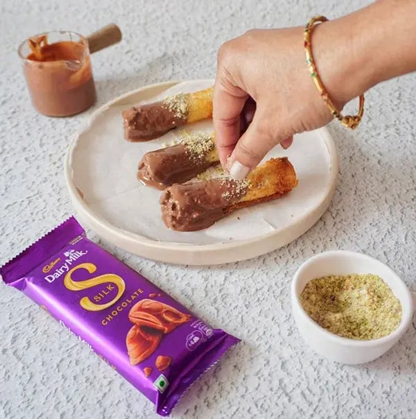 Chocolate Coated Bread Roll - Sprinkle finely chopped pistachios