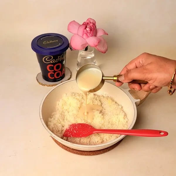 Chocolate Coconut Modak With Cadbury Cocoa Powder For Ganpati Bappa - Mixing Condensed Milk