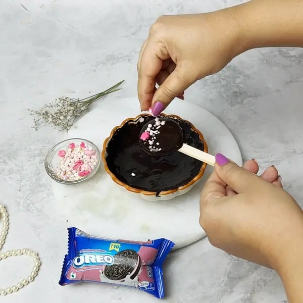 Chocolate-Covered Oreo Pops - Sprinkling Oreo Pops