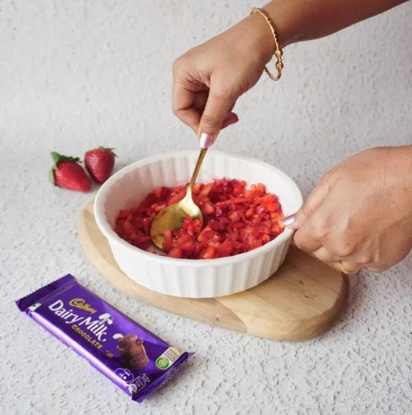 Chocolate Covered Strawberry Chia Bites - Mashing the strawberries