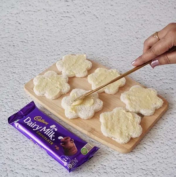 Chocolate Daisy Sandwich Appetizers with Gems - Add butter to the pieces