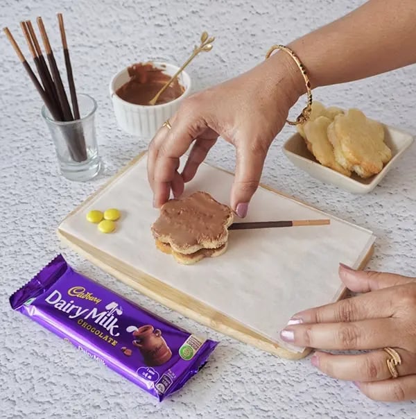 Chocolate Daisy Sandwich Appetizers with Gems - Top with another chocolate coated bread flower