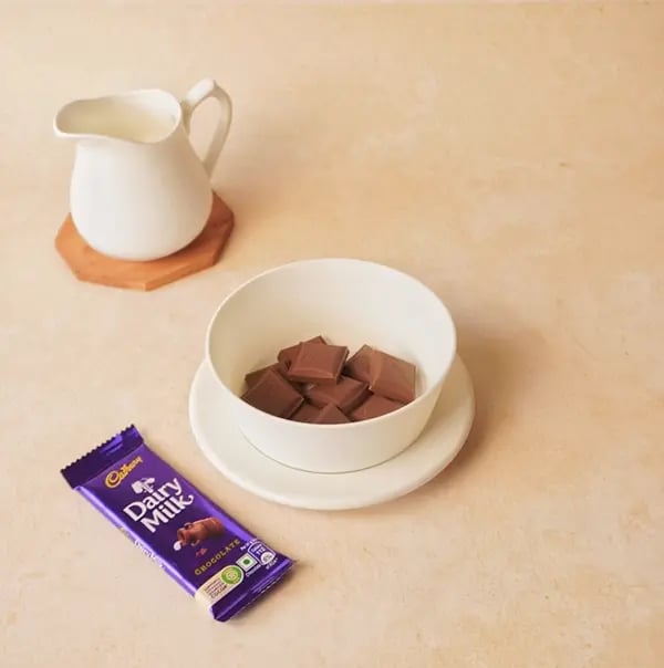 Chocolate French Toast with Cadbury Dairy Milk-In a bowl add a few pieces of Dairy Milk chocolate