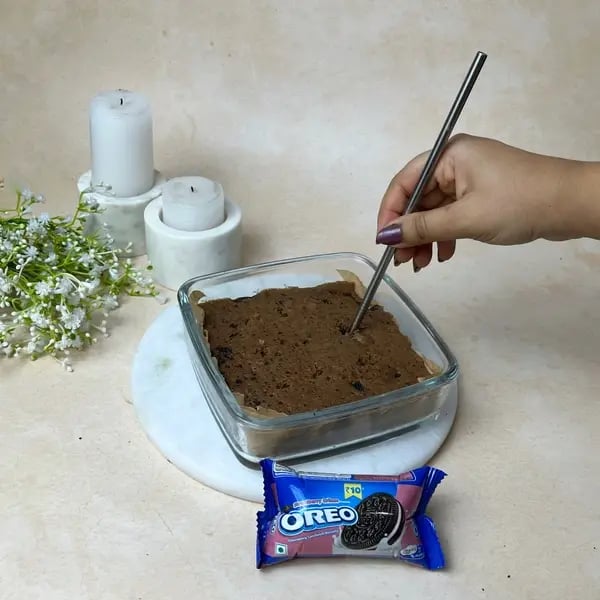 Chocolate Oreo Poke Cake - Poking Cake Holes