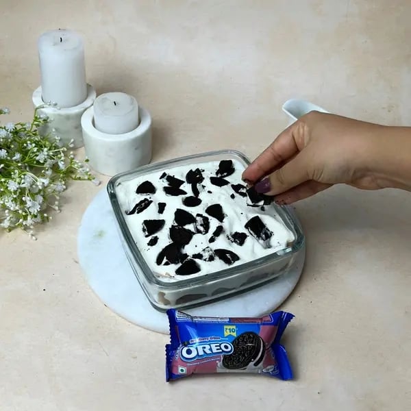 Chocolate Oreo Poke Cake - Crushed Oreos Topping