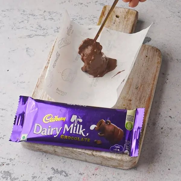 Chocolate Peanut Butter Bark - Melted chocolate on a parchment paper