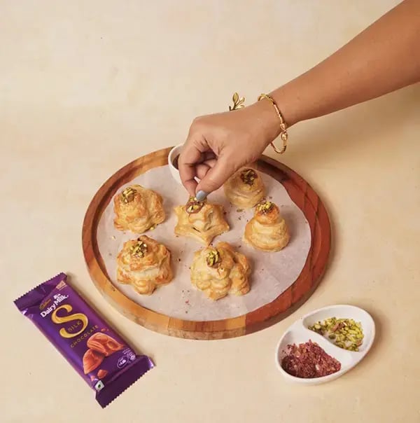 Chocolate Puff Pastry Rakhi With Cadbury Dairy Milk Silk For Raksha Bandhan - Sprinkle finely chopped pistachios