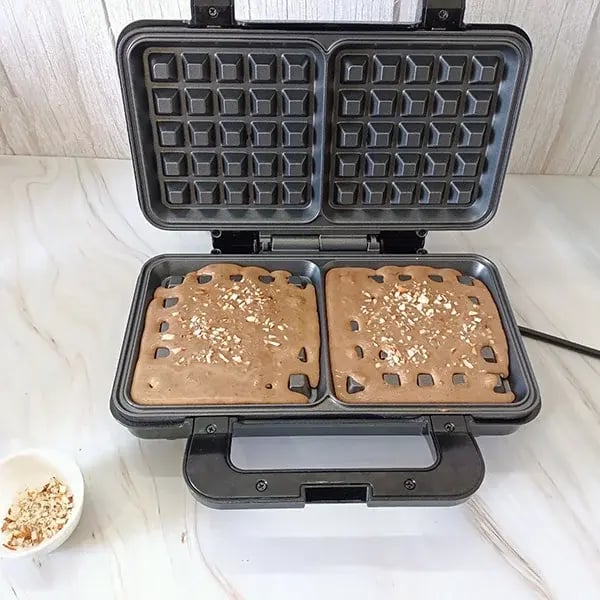 Chocolate Rice Pudding Waffles with Almond Crunch Topping - Pour the batter onto a waffle maker