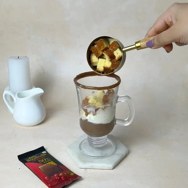 Classic Bournville Hot Fudge Sundae - Adding Cake Pieces