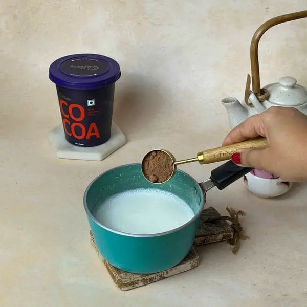 Cocoa Bournville Chocolate Nobake Biscuit Cake - Adding Cocoa Powder