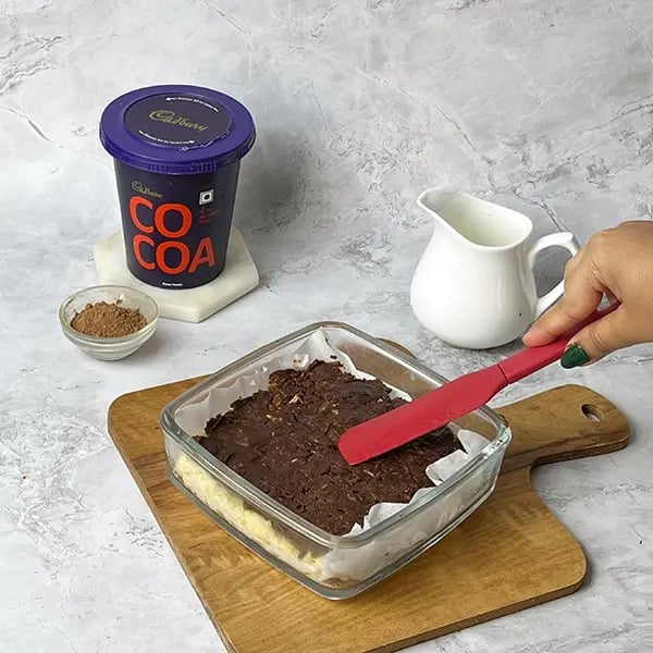 Cocoa Brownie Barfi-Transfer the brownie mixture