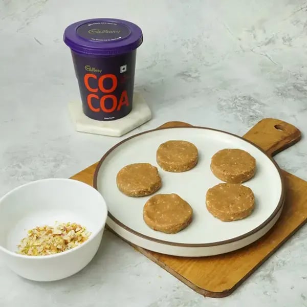 Cocoa Sandesh With Nuts - Roll each portion