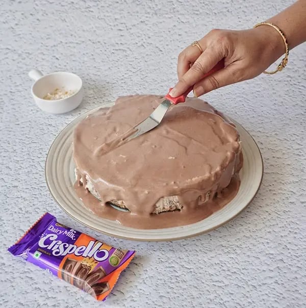 Coconut Cream Pie with Cadbury Dairy Milk Crispello - Spread the whipped cream