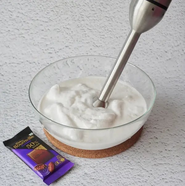 Coconut Ice Cream with Bournville Crunch - Add the coconut milk, coconut cream