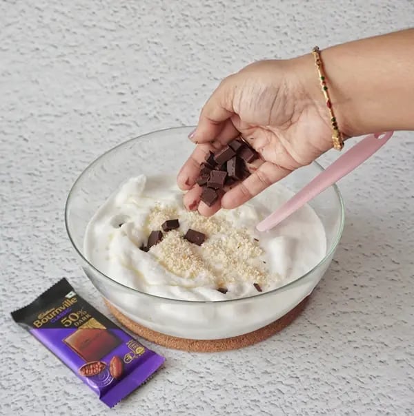 Coconut Ice Cream with Bournville Crunch - Fold in the chopped Bournville chunks