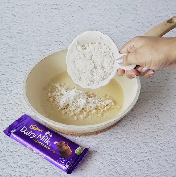 Coconut Laddoo With Dairy Milk And Jaggery-In a pan add ghee