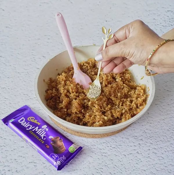 Coconut Laddoo With Dairy Milk And Jaggery-Once its cooked well add cardamom powder
