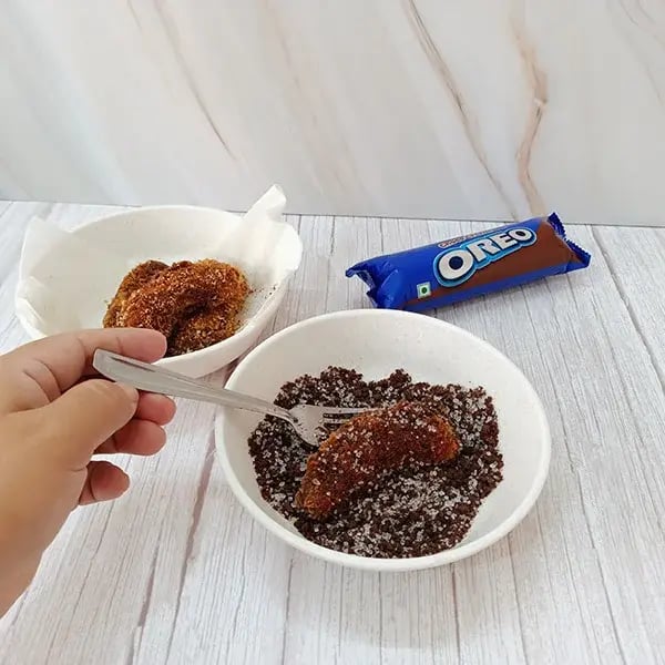 Crispy Banana Fritters with Oreo Crumbs - Combine sugar and crushed Oreo