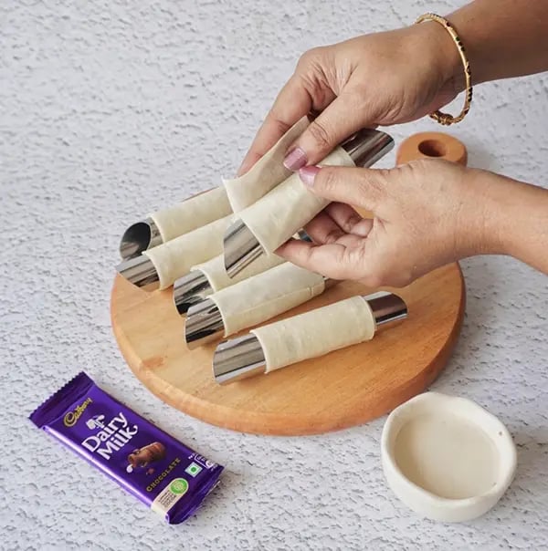 Crispy Rolls with Coconut and Dairy Milk Chocolate- Shape each half into a cone