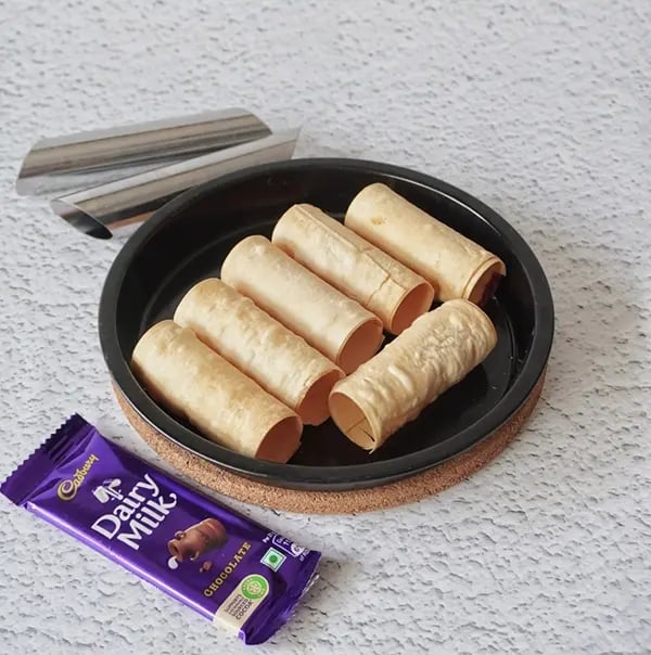 Crispy Rolls with Coconut and Dairy Milk Chocolate- Once baked remove the mould