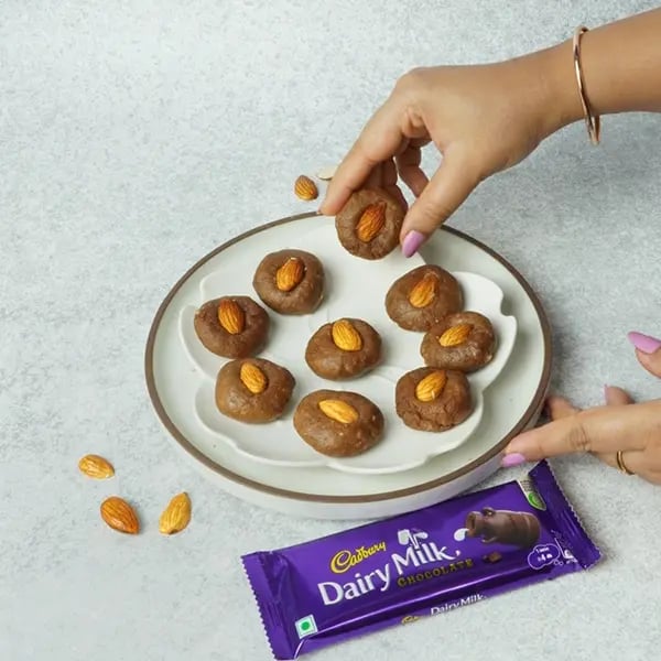Dairy Milk Almond Peda-Place one whole almond on top of each peda