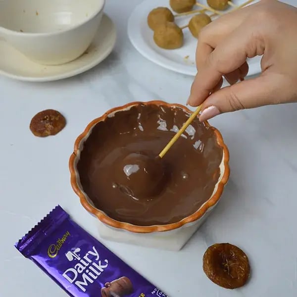 Dairy Milk and Dried Fig Fudge Pop - Dip fig balls in melted chocolate
