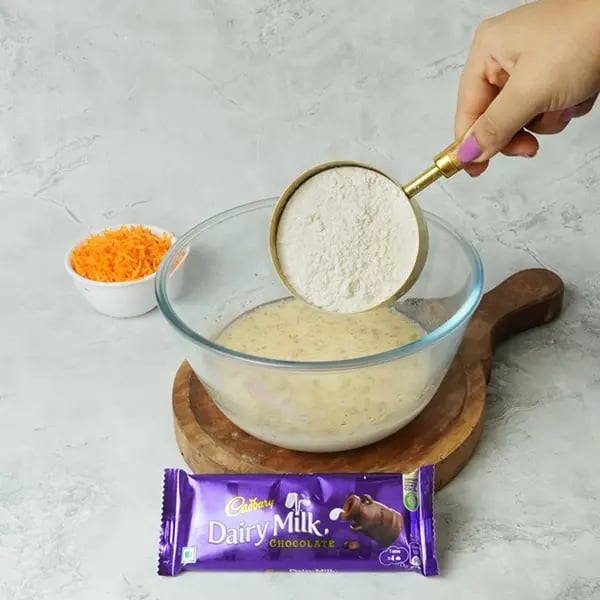Dairy Milk Carrot Cake-Add all-purpose flour into the same bowl